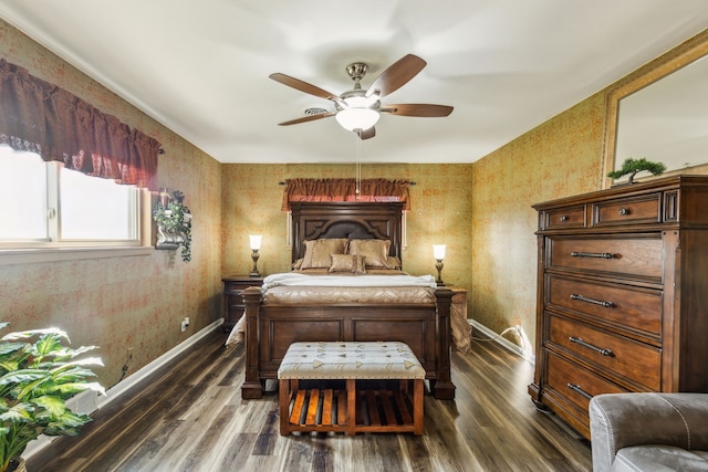 bedroom with ceiling fan and dark hardwood / wood-style floors