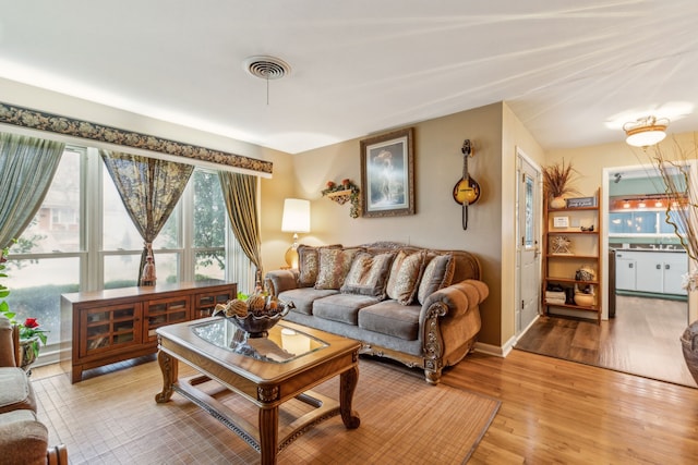 living room with light hardwood / wood-style flooring