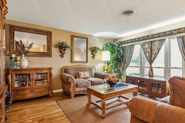 living area with light hardwood / wood-style floors