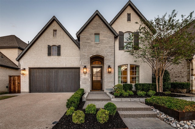 french country home with a garage