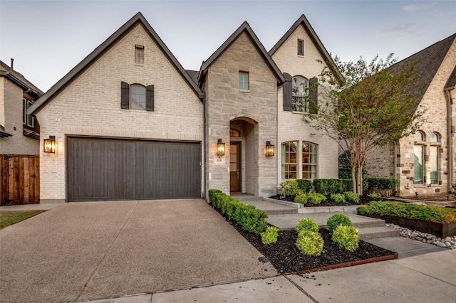 french provincial home with a garage