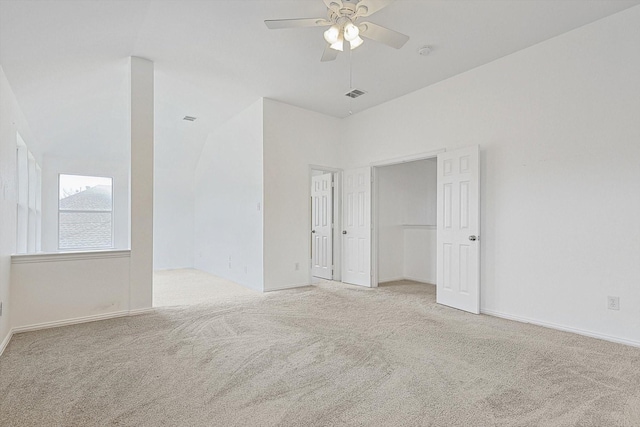 spare room with ceiling fan, baseboards, visible vents, and light colored carpet