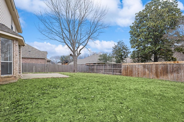 view of yard featuring a fenced backyard and a patio