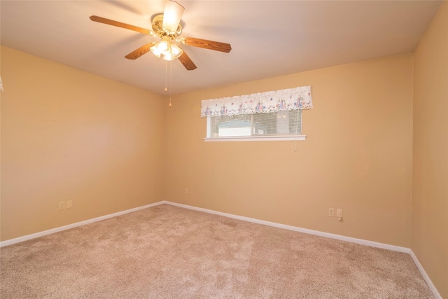 spare room with ceiling fan and carpet flooring