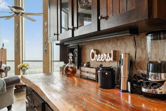 kitchen featuring dark brown cabinets and ceiling fan