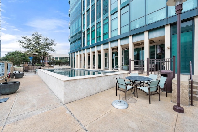 view of swimming pool featuring a patio area