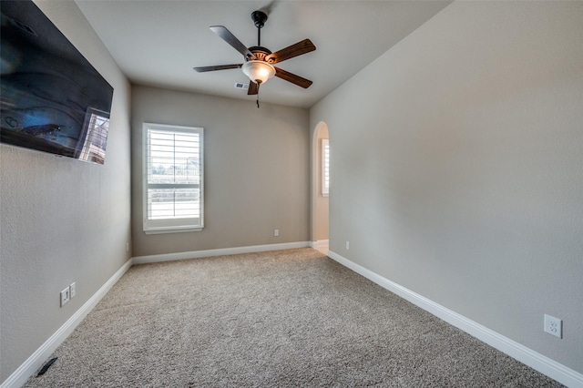 carpeted empty room with ceiling fan