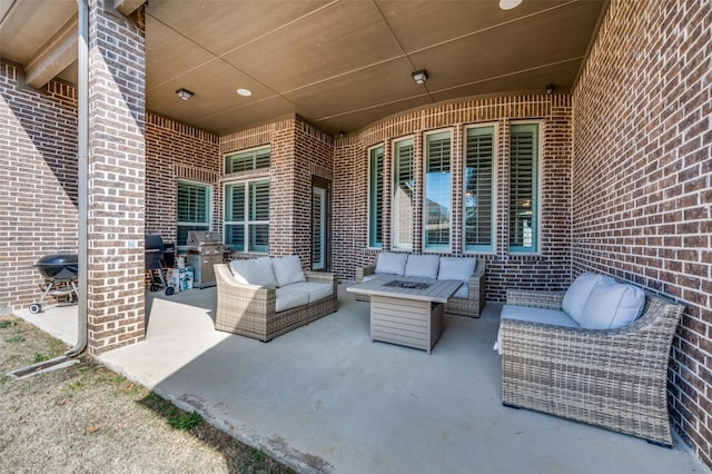 view of patio / terrace featuring an outdoor living space and grilling area