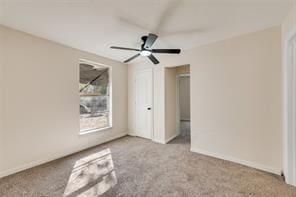 unfurnished bedroom featuring carpet floors and ceiling fan