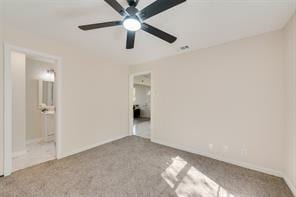 unfurnished bedroom featuring light carpet