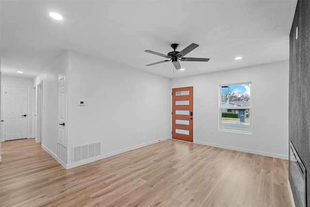 entrance foyer with ceiling fan and light wood-type flooring