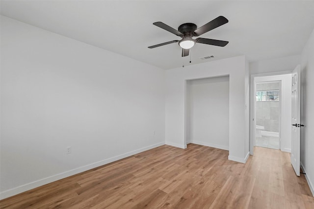 unfurnished bedroom featuring a closet, ceiling fan, and light wood-type flooring