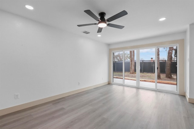 spare room featuring recessed lighting, baseboards, visible vents, and light wood finished floors