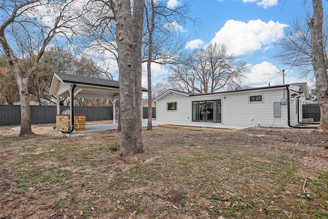 back of property with a patio and fence