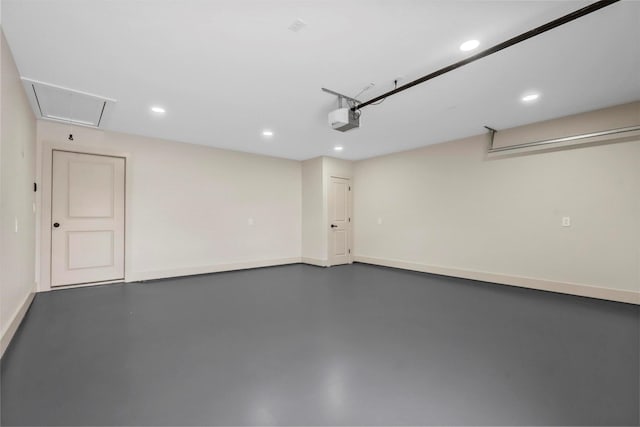 garage featuring baseboards, recessed lighting, and a garage door opener