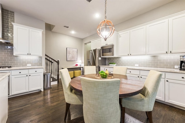 dining area with dark wood-type flooring