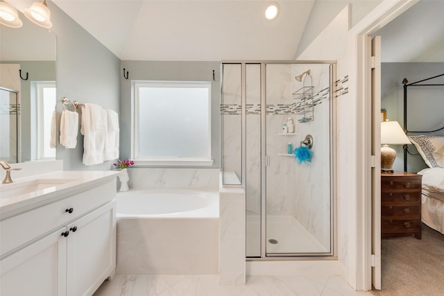 bathroom with plenty of natural light, separate shower and tub, and vaulted ceiling