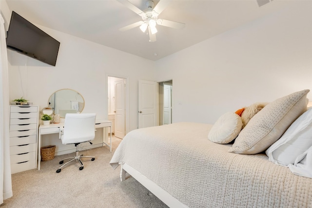 carpeted bedroom with connected bathroom and ceiling fan