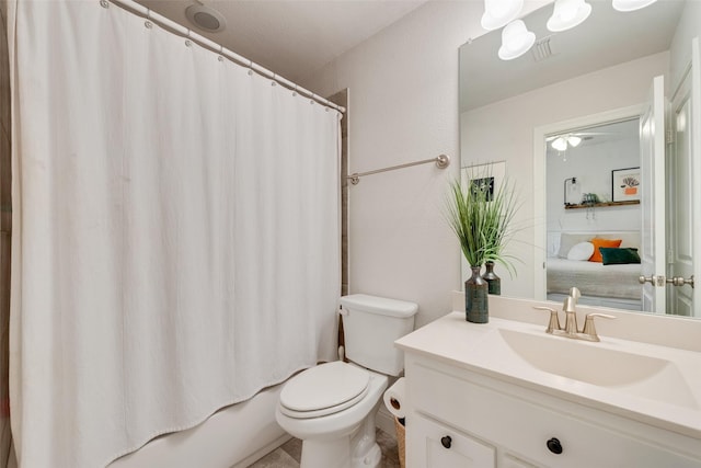 full bathroom featuring shower / bathtub combination with curtain, vanity, and toilet