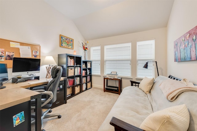 office space featuring lofted ceiling and light colored carpet