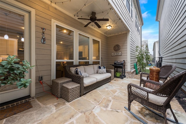 view of patio featuring ceiling fan and an outdoor living space