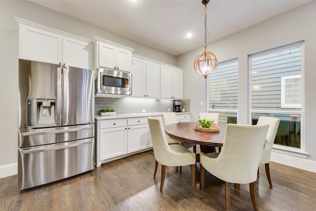 dining space featuring dark hardwood / wood-style flooring