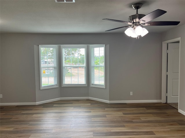 unfurnished room with hardwood / wood-style floors