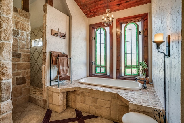505 Mccormick Rd, Oak Point, TX 75068 - full bath featuring inlaid floor details, healthy amount of natural light, a bath, vaulted ceiling, and a tile shower