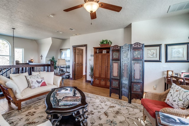 505 Mccormick Rd, Oak Point, TX 75068 - living area featuring a textured ceiling, a ceiling fan, and wood finished floors