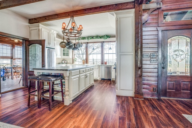 505 Mccormick Rd, Oak Point, TX 75068 - kitchen with a chandelier, dark wood-type flooring, a kitchen island, beamed ceiling, and appliances with stainless steel finishes