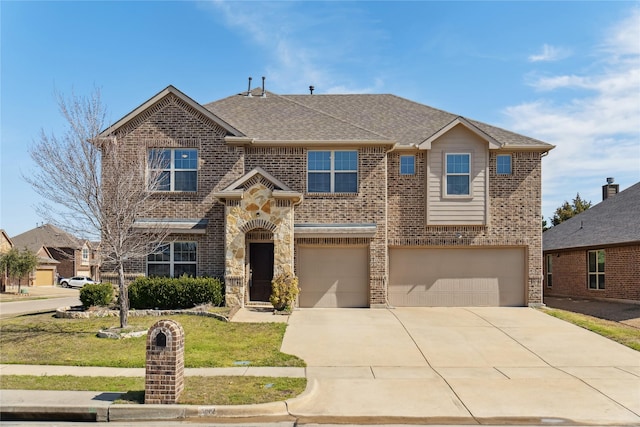 view of front of home with brick siding, a shingled roof, an attached garage, a front yard, and driveway