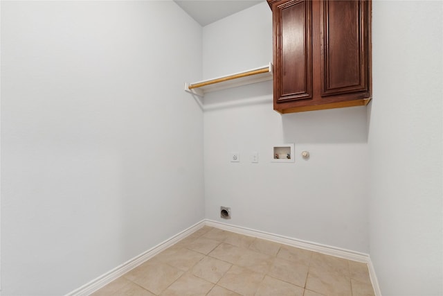 laundry room featuring washer hookup, hookup for a gas dryer, cabinet space, hookup for an electric dryer, and baseboards