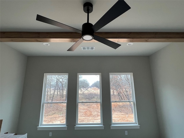 room details featuring beamed ceiling and ceiling fan