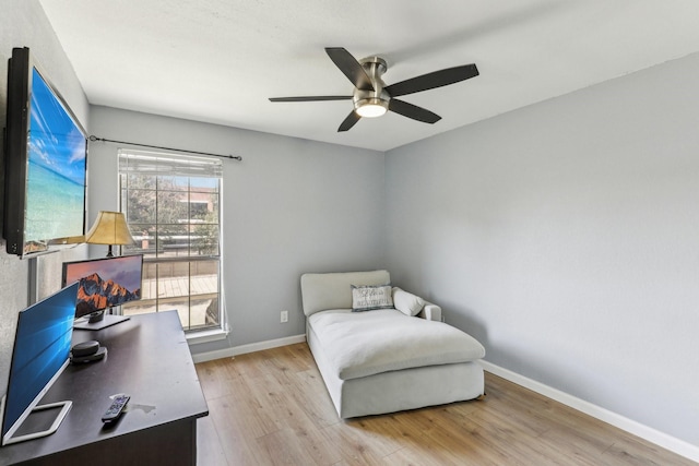 sitting room featuring ceiling fan and light hardwood / wood-style floors