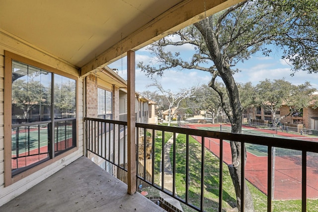 balcony featuring tennis court