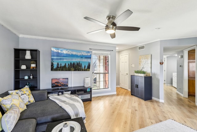 living room featuring crown molding, ceiling fan, and light hardwood / wood-style floors