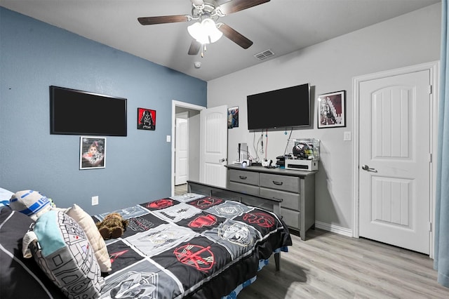 bedroom featuring ceiling fan and light hardwood / wood-style floors