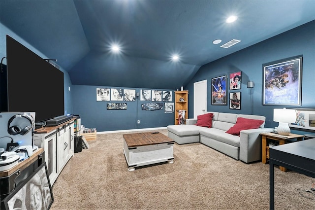 cinema room featuring carpet floors and vaulted ceiling