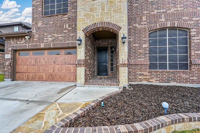 doorway to property featuring a garage