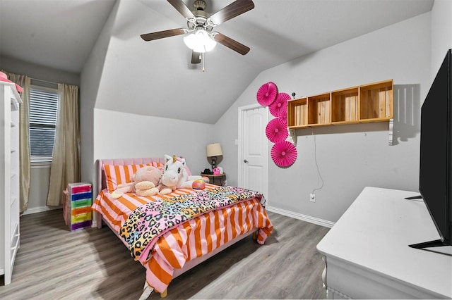 bedroom with vaulted ceiling, ceiling fan, and hardwood / wood-style floors