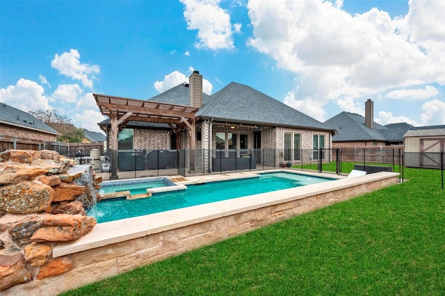 rear view of house with a pergola, a yard, a patio area, and a pool with hot tub