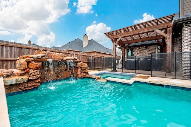 view of swimming pool featuring a pergola, pool water feature, and an in ground hot tub