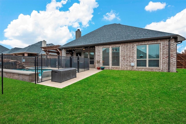 rear view of property with a fenced in pool, a yard, a pergola, and a patio