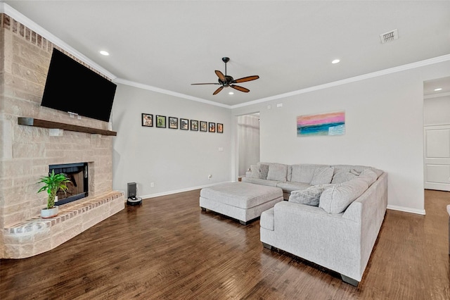 living room with crown molding, ceiling fan, and dark hardwood / wood-style flooring