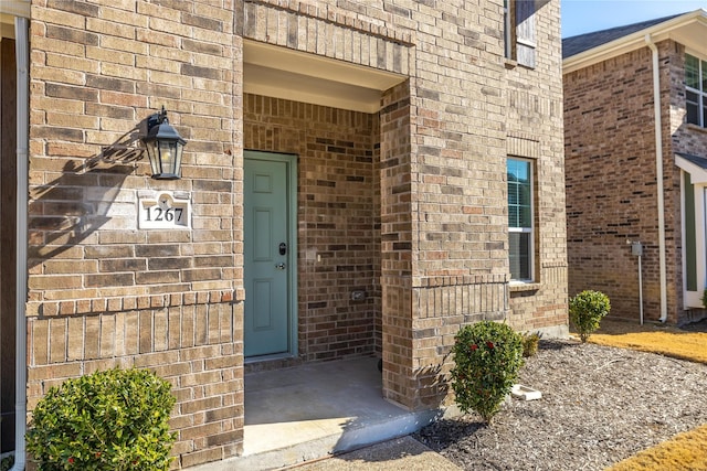 1267 Jones Trl, Lewisville, TX 75077 - view of exterior entry featuring brick siding