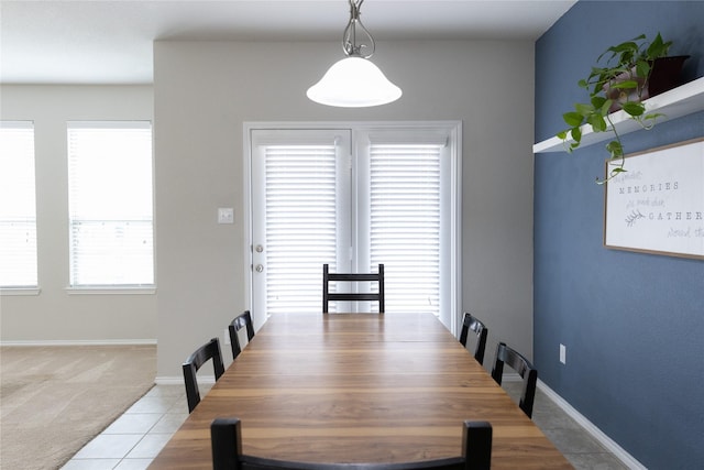 dining area with light tile patterned flooring