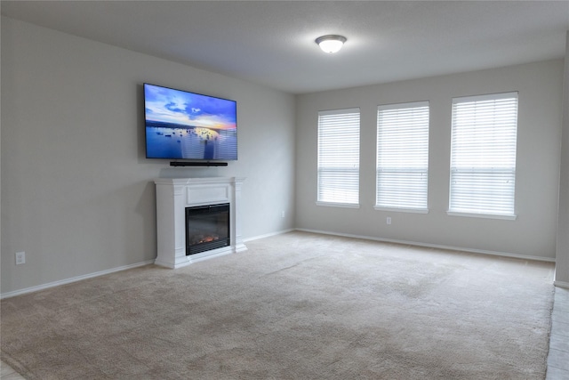 unfurnished living room with light carpet