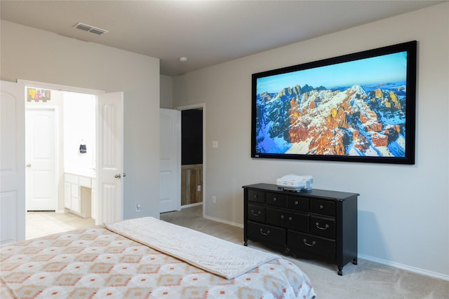 bedroom featuring light colored carpet