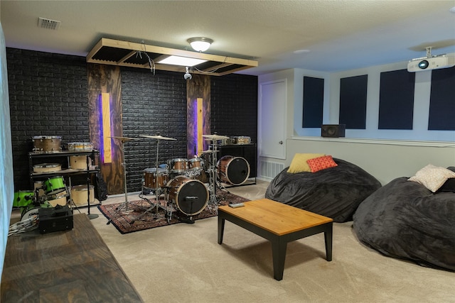 living room with brick wall, light carpet, and a textured ceiling