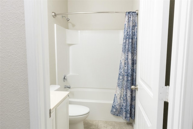 full bathroom with tile patterned floors, vanity, toilet, and shower / bath combo with shower curtain